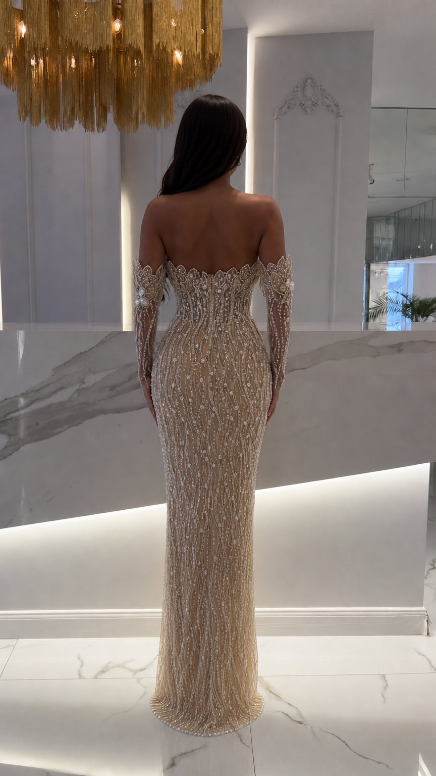 Back view of champagne floor-length beaded evening gown