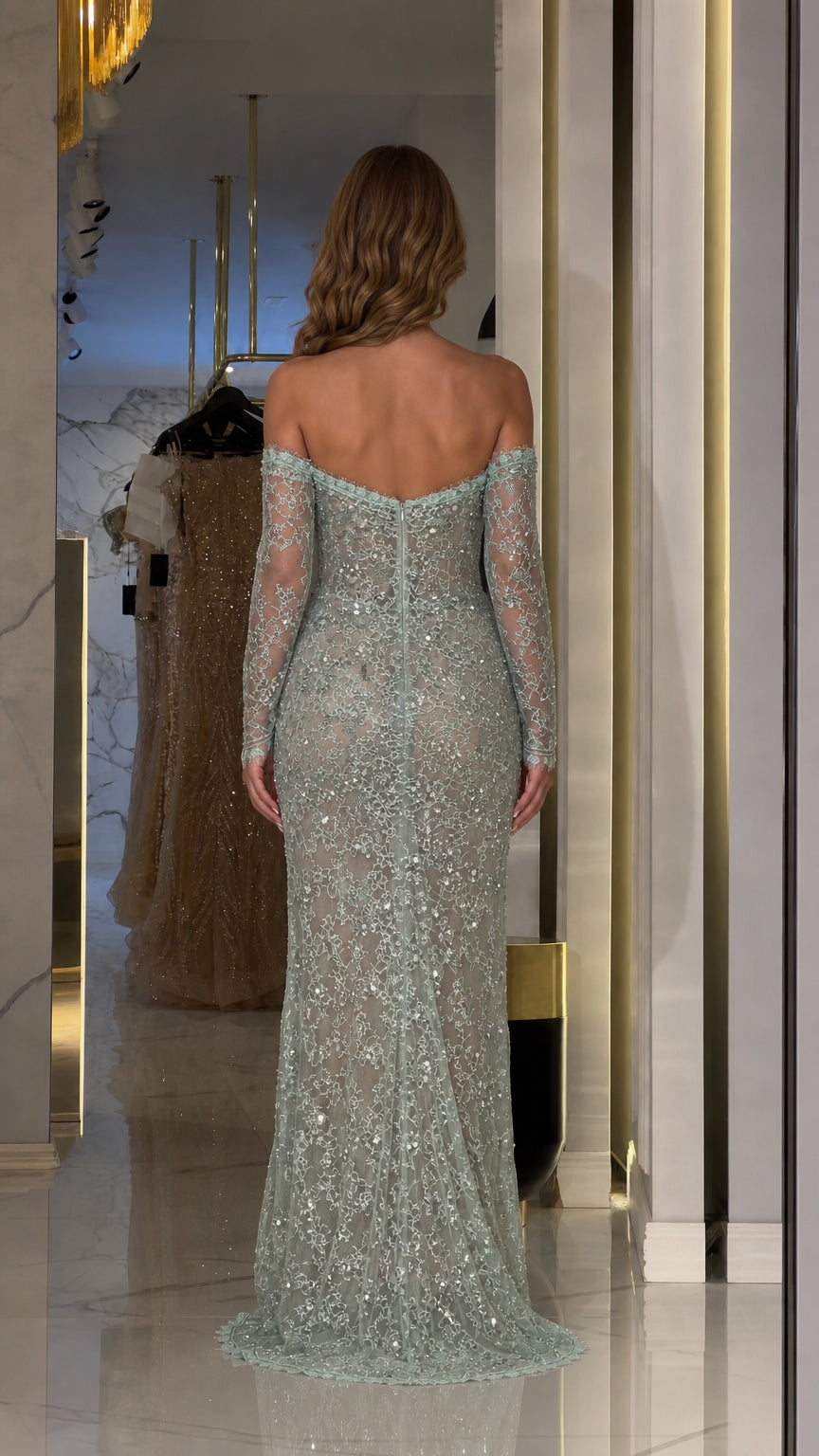 Back view of woman wearing sage green off-the-shoulder beaded lace gown
