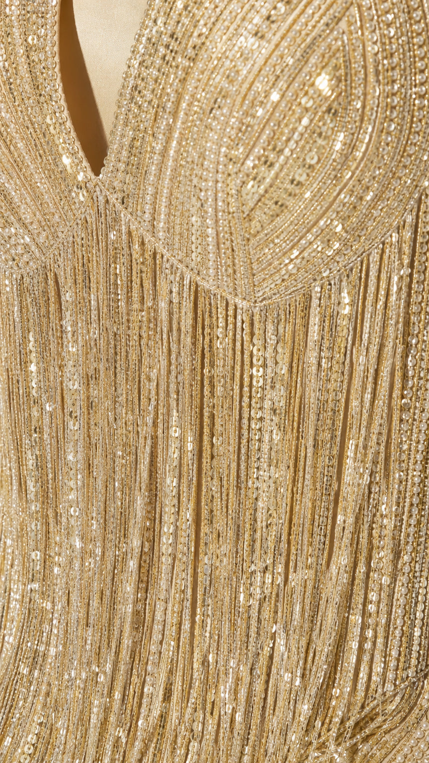 Close-up detail of Champagne Gold sequined bodice and hanging fringe tassels