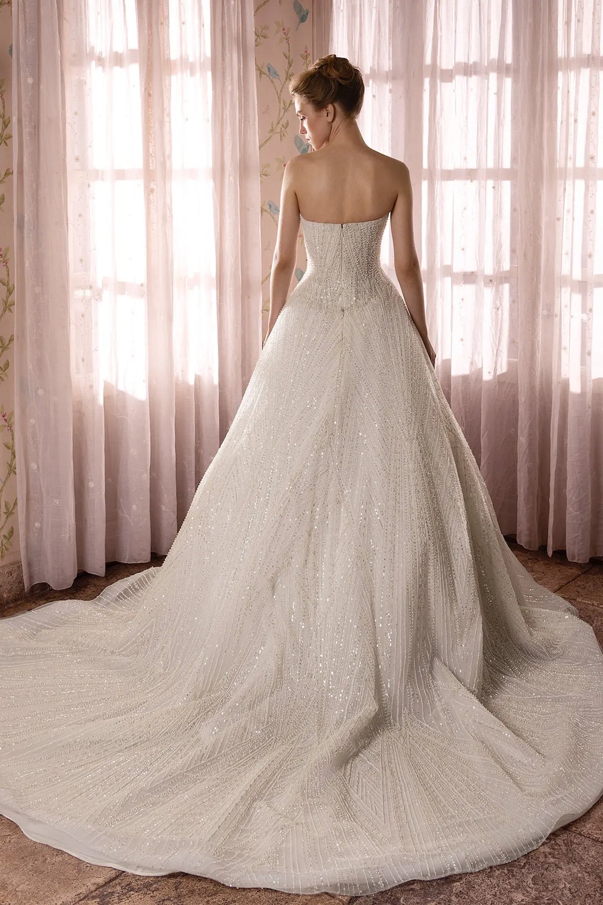 Strapless bridal gown featuring pearl and crystals