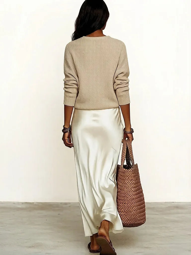 Effortlessly create an ivory knit satin midi skirt suit