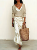 Effortlessly create an ivory knit satin midi skirt suit