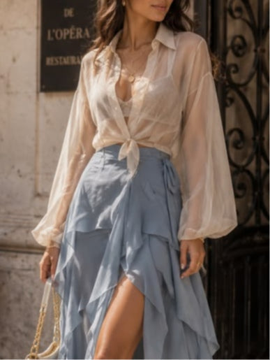 White sheer shirt paired with a blue layered skirt set