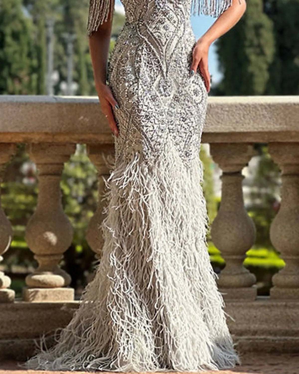 Crystal-embellished fringed feather gown