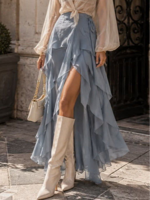 White sheer shirt paired with a blue layered skirt set